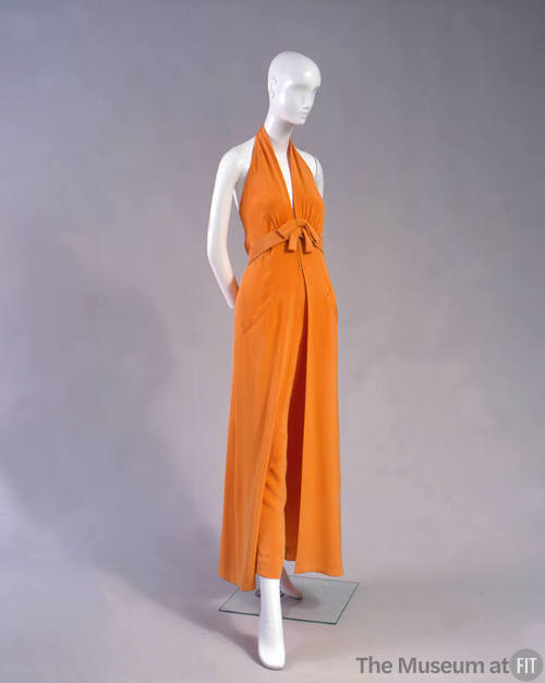Orange wide leg pants with halter top and belt with self tie bow 