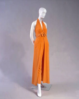 Orange wide leg pants with halter top and belt with self tie bow 