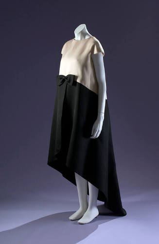 Evening tent dress with white capsleeve bodice and black flared skirt with asymmetrical hem 