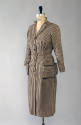 Brown and cream check button front dress with four pockets, padded shoulders, and buckle belt