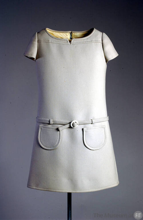 Light grey A-line mini dress, cap sleeves, belted drop waist, and round patch pockets