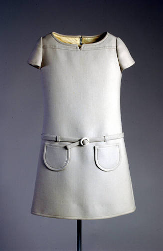 Light grey A-line mini dress, cap sleeves, belted drop waist, and round patch pockets