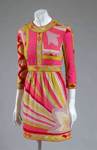 3/4 sleeve knee length dress with print of pink, yellow, and white rays emanating from a pink f…