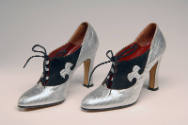 Silver snakeskin high heel with black suede detailing and laces