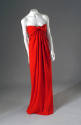 Red draped floor length strapless evening dress with tie front