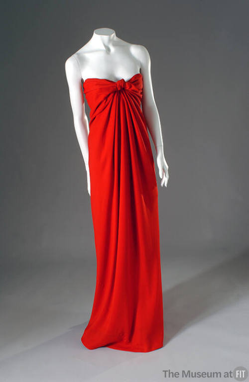 Red draped floor length strapless evening dress with tie front
