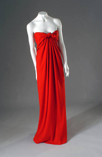 Red draped floor length strapless evening dress with tie front