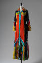 Floor length, shirt style gown with multicolor floral print in black, red, green and yellow