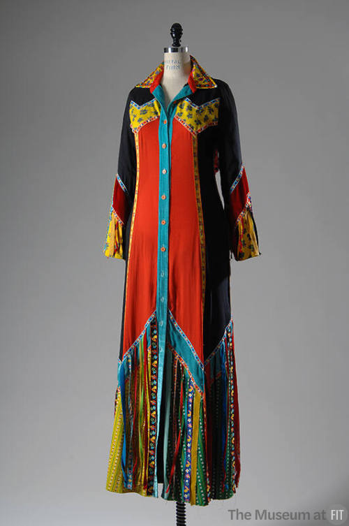 Floor length, shirt style gown with multicolor floral print in black, red, green and yellow
