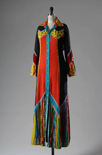 Floor length, shirt style gown with multicolor floral print in black, red, green and yellow