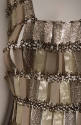 Dress bodice: pearlescent and silver plastic rectangles linked by metal loops 