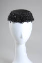 Black cocktail hait with faceted jet beads forming ring and fringe