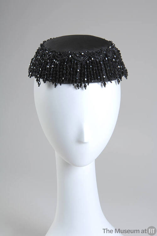 Black cocktail hait with faceted jet beads forming ring and fringe