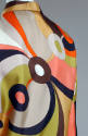 Back view of screen printed top of multicolor, large scale geometric print in brown, pink, yell…