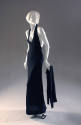 Black rib knit cardigan sweater and matching floor length V neck, halter gown