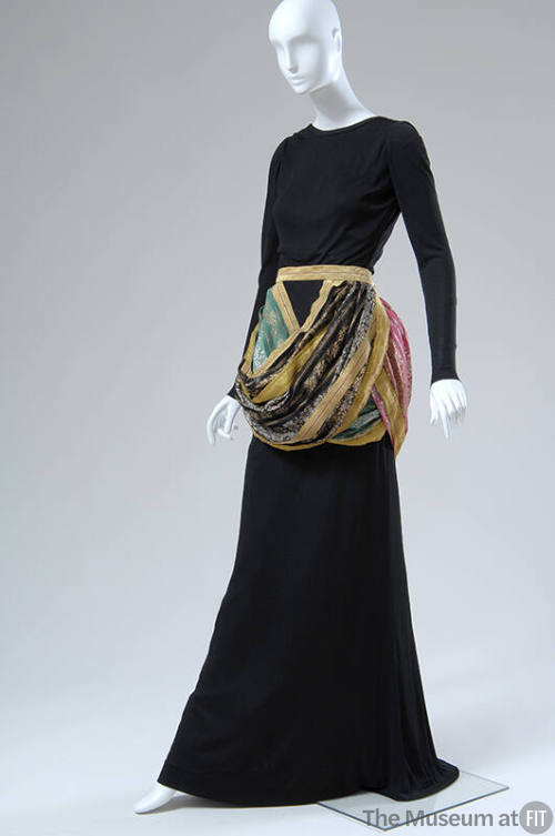 Black long sleeve fitted dress with multicolor draped hip band 