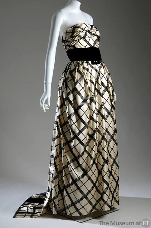 Black and off-white plaid strapless evening gown, floor length, with wide black buckled cummerb…