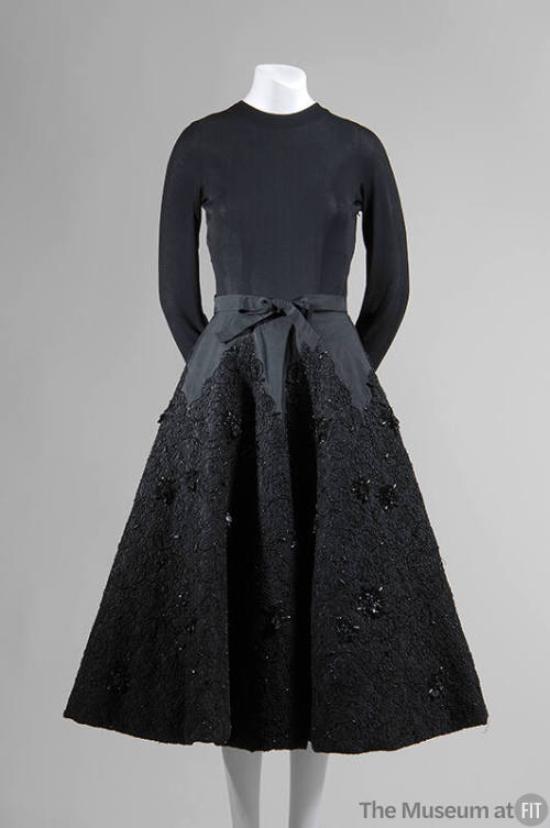 Black evening dress with long sleeved jersey bodice and below the knee skirt with jet beaded bl…