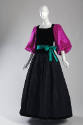 Black floor length gown with square neck, full skirt, fuchsia balloon sleeves and green tie bel…