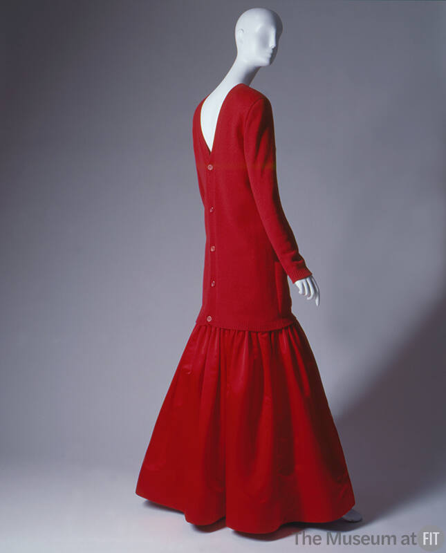 Red cashmere cardigan with deep V that opens to the back and hits below hips with floor length,…