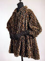 Tent style coat in broken stripes of grey, brown, tan and black velvet with cuffed puffed sleev…
