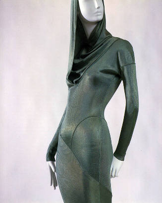 Detail of green hooded form-fitting dress
