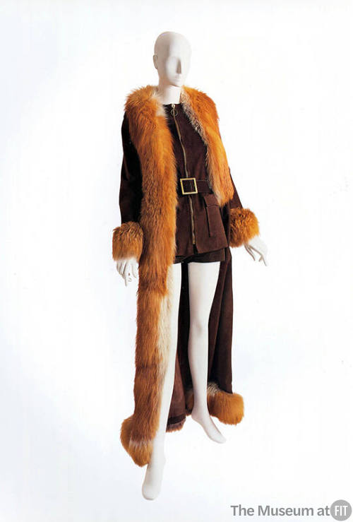 Brown suede zip front vest, hot pants and floor length coat with orange fur trim and cuffs