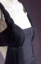 Detail of pleated gown bodice with braided straps