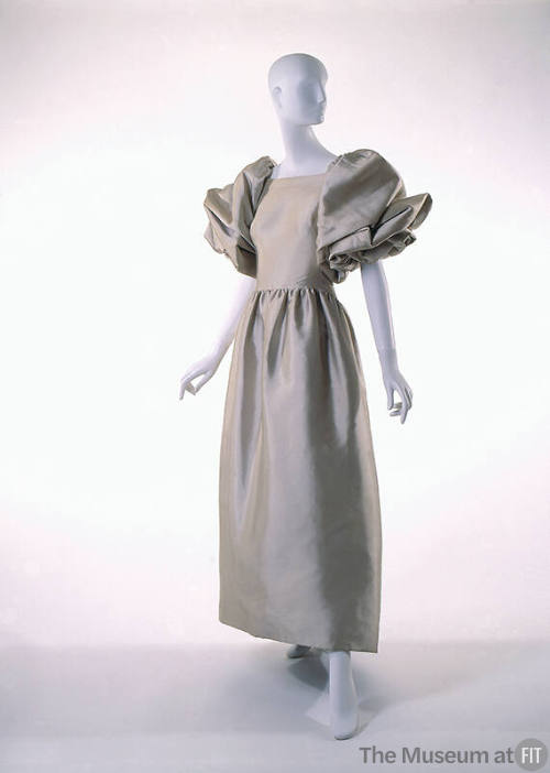 Beige satin ankle length dress with large puffed draped sleeves to elbow, gathered waist