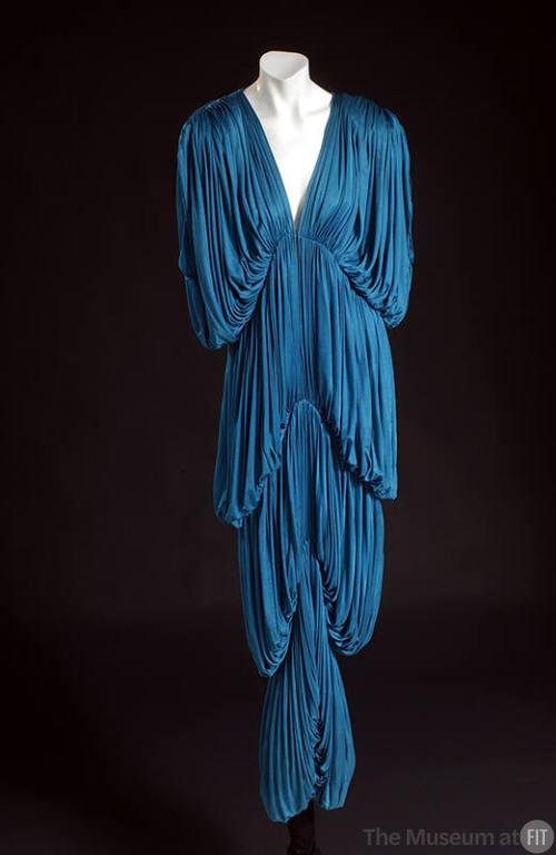 Blue fully pleated V-neck floor length gown, drop three-quarter sleeves