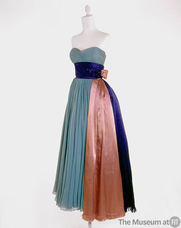 Pale blue strapless evening gown with blue and pink satin cummerbund draped to full skirt hem