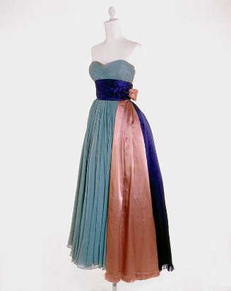 Pale blue strapless evening gown with blue and pink satin cummerbund draped to full skirt hem