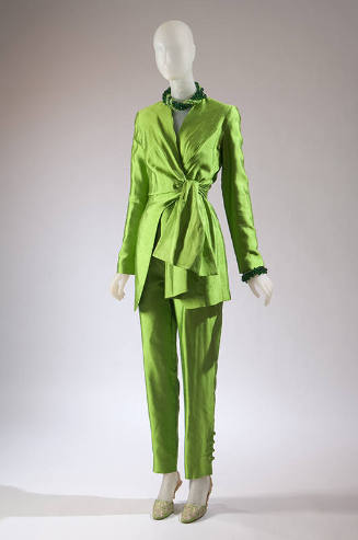 Green silk long sleeve side tie tunic, matching slim pants, green beaded necklace and bracelet,…