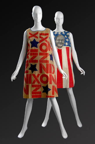 Right: paper shift dress dress printed with NIXON and blue stars Left: paper dress printed with…