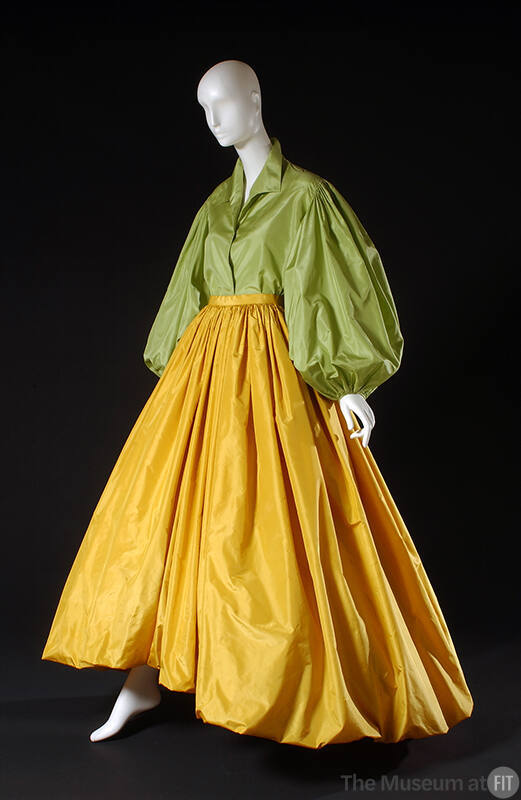 Green blouse with large puffy long sleeves and yellow floor length gathered skirt with balloon …