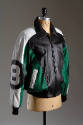 Black, white and green leather zip front jacket with large #8 in circle patch on long sleeve