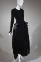 Alternate view of long sleeve black velvet ankle length dress with large bows at side hips