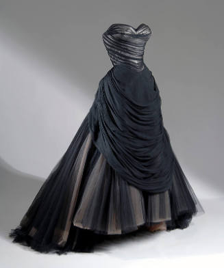 Black strapless ballgown with pleated bodice and apron and full skirt