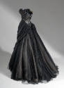 Back view of black strapless ballgown with pleated bodice and full gathered skirt
