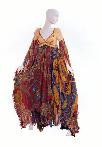 Multicolor floral pattern floor length dress with beige leather bodice with red stitching 