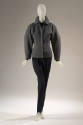 Grey long sleeve zip front jacket and black stirrup pants