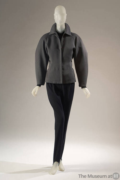 Grey long sleeve zip front jacket and black stirrup pants