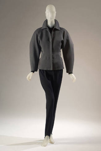 Grey long sleeve zip front jacket and black stirrup pants