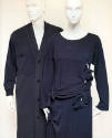 Left: blue long sleeve button front V-neck sweater Right: blue top and skirt with cut-outs and …