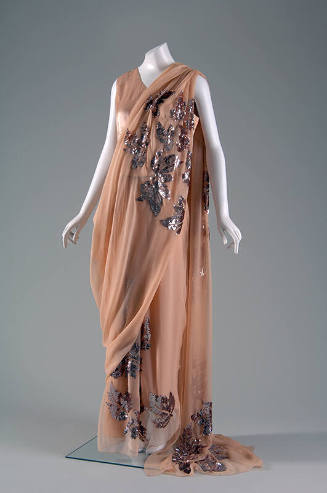 Peach floor length sari with large sequined leaves throughout