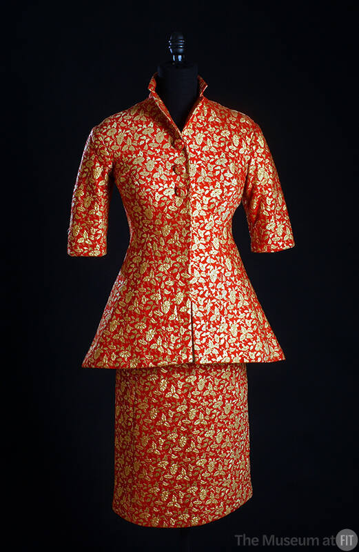 Red suit with gold floral brocade, 3/4 length sleeves, jacket flared below the waist and knee l…