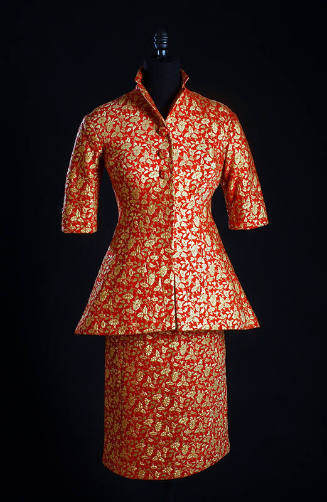 Red suit with gold floral brocade, 3/4 length sleeves, jacket flared below the waist and knee l…