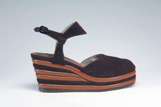 Brown platform wedge shoe with ankle strap and alternating layers of brown in wedge