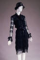 Long sleeve coat dress in alternating horizontal bands of black lace and chiffon with ribbon be…