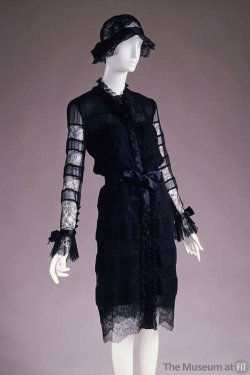 Long sleeve coat dress in alternating horizontal bands of black lace and chiffon with ribbon be…
